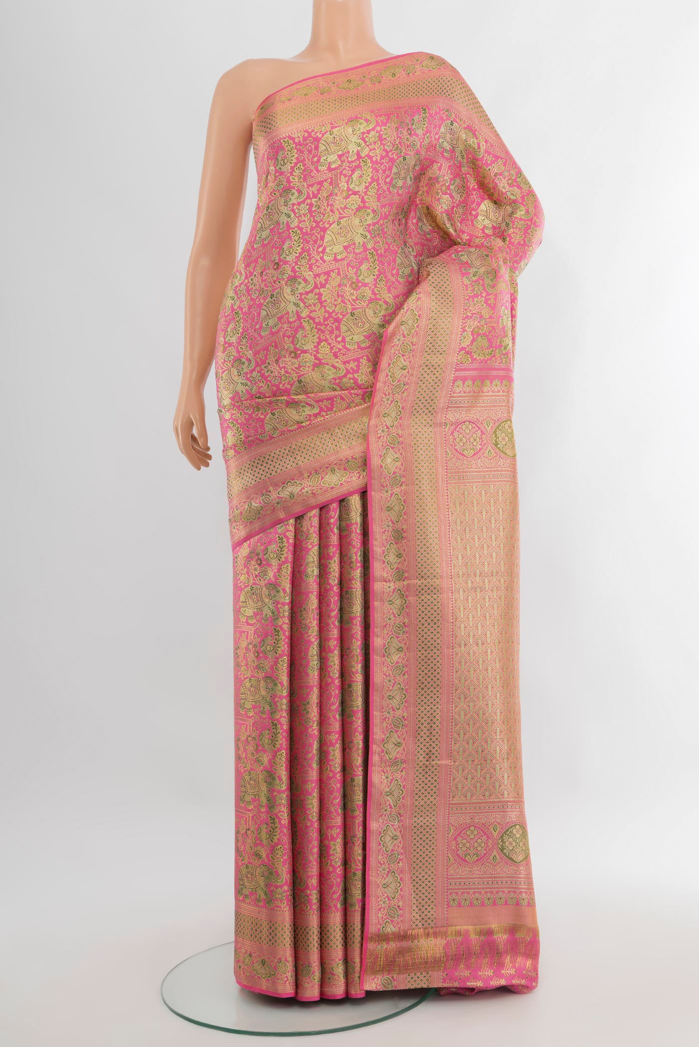 Rose pink Kanchipuram Tissue Silk Saree with Zari Brocade on the body and Zari Border.  displayed on a mannequin
