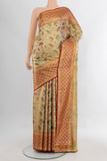 Golden Kanchipuram Tissue Silk Saree with Zari Brocade on the body and Zari Border.  displayed on a mannequin
