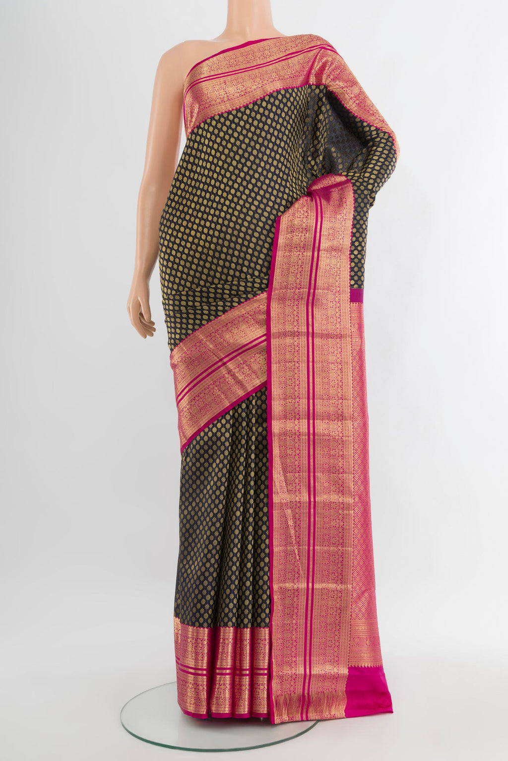 Black Kanchipuram Silk Saree with Zari Brocade on the body and Zari Border.  displayed on a mannequin