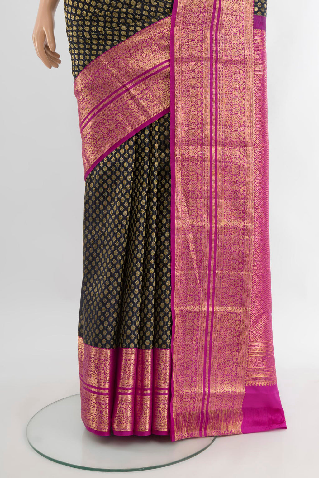 Pleats and pallu of Black Kanchipuram Silk Saree with Zari Brocade on the body and Zari Border. 