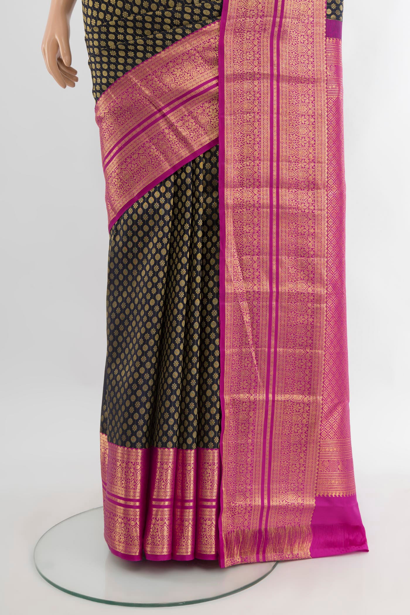 Pleats and pallu of Black Kanchipuram Silk Saree with Zari Brocade on the body and Zari Border. 