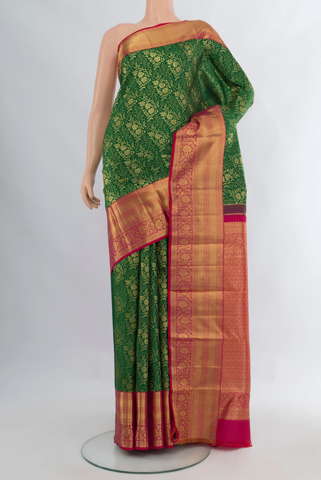 Pure Silk Green Kanchipuram Saree with Zari Brocade on the body and Zari Border.  displayed on a mannequin