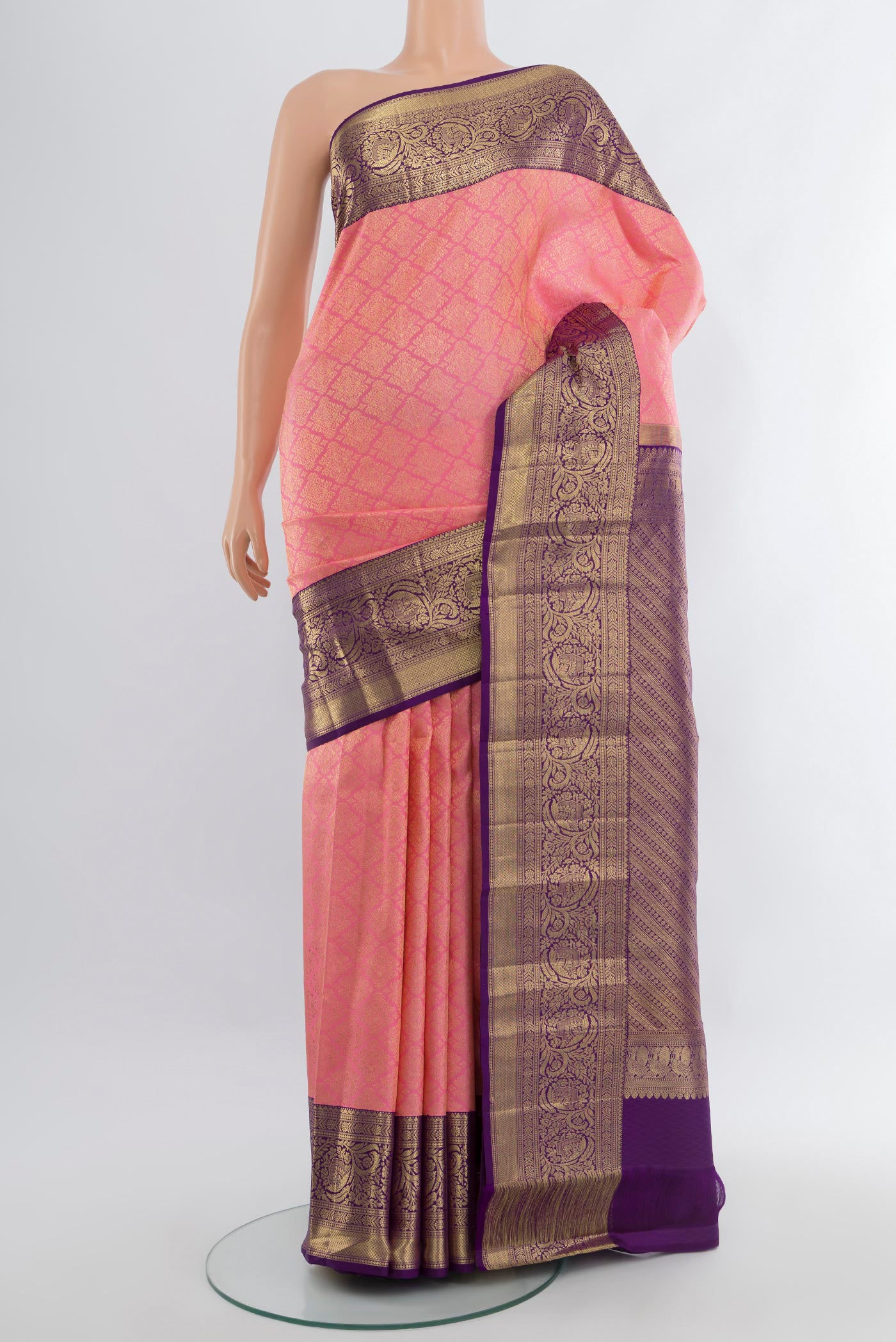 Rose pink Kanchipuram Silk Saree with Zari Brocade on the body and Zari Border.  displayed on a mannequin