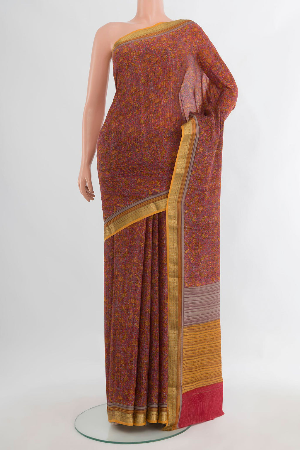 Coral Crepe Saree with Printed design on the body and Zari Border.  displayed on a mannequin