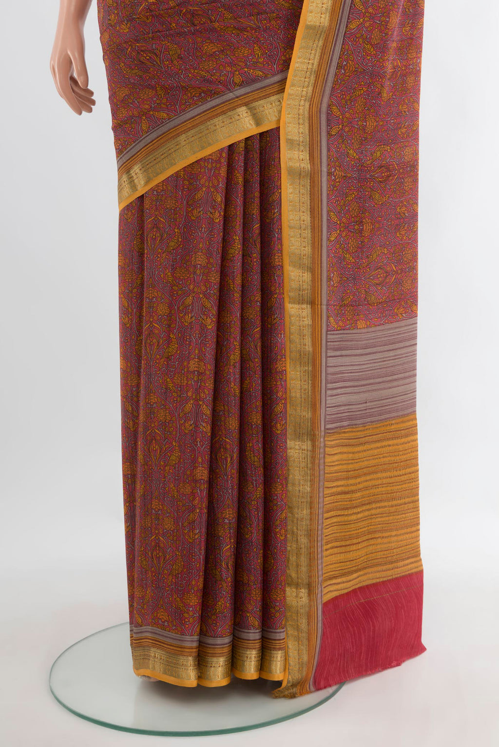 Pleats and pallu of Coral Crepe Saree with Printed design on the body and Zari Border. 