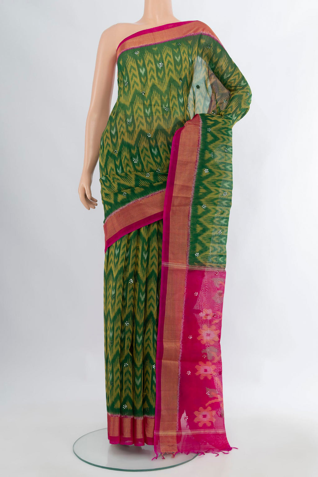 Green Silk Cotton Saree with Ikat Print on the body and Zari Border.  displayed on a mannequin