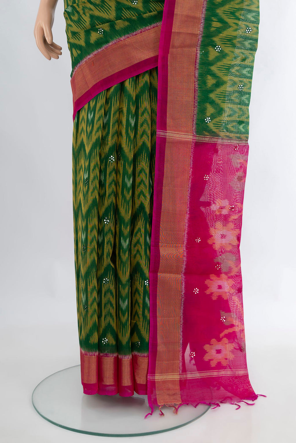 Pleats and pallu of Green Silk Cotton Saree with Ikat Print on the body and Zari Border. 