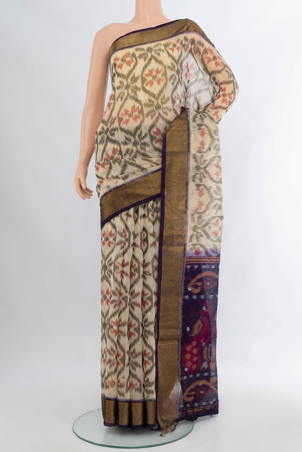 Cream Silk Cotton Saree with Ikat Print on the body and Zari Border.  displayed on a mannequin