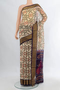 Cream Silk Cotton Saree with Ikat Print on the body and Zari Border.  displayed on a mannequin