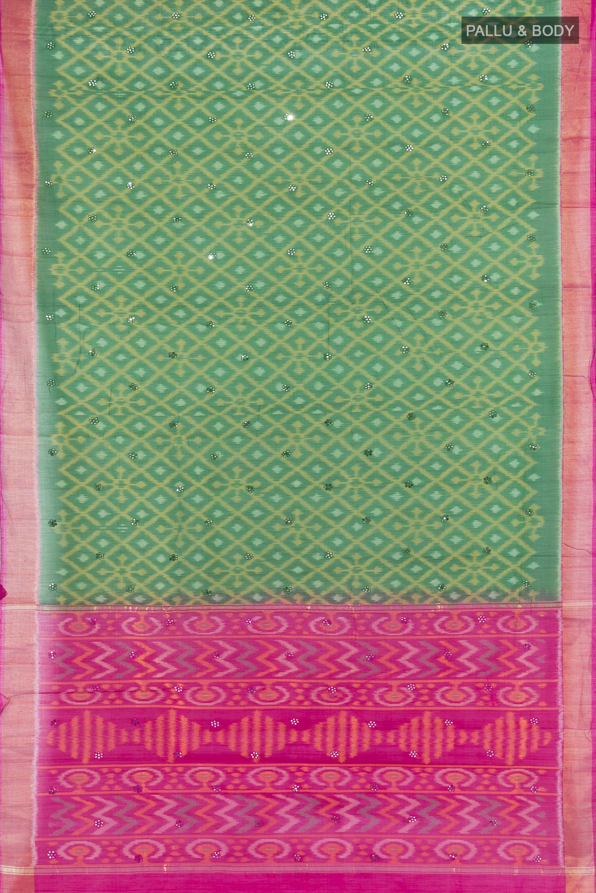 Flat view of Bottle Green Silk Cotton Saree with Ikat design on the body and Zari Border. 