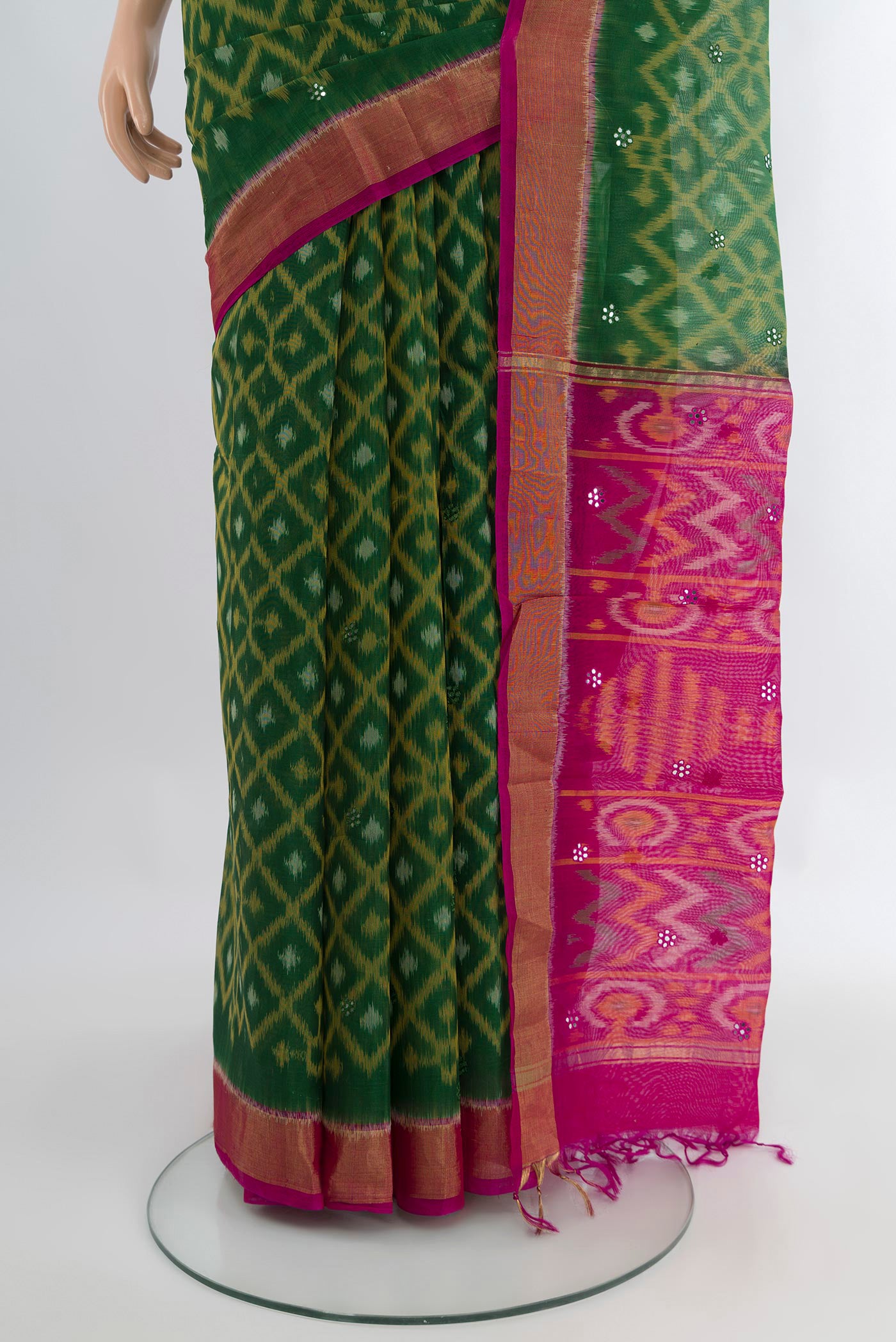 Pleats and pallu of Bottle Green Silk Cotton Saree with Ikat design on the body and Zari Border. 