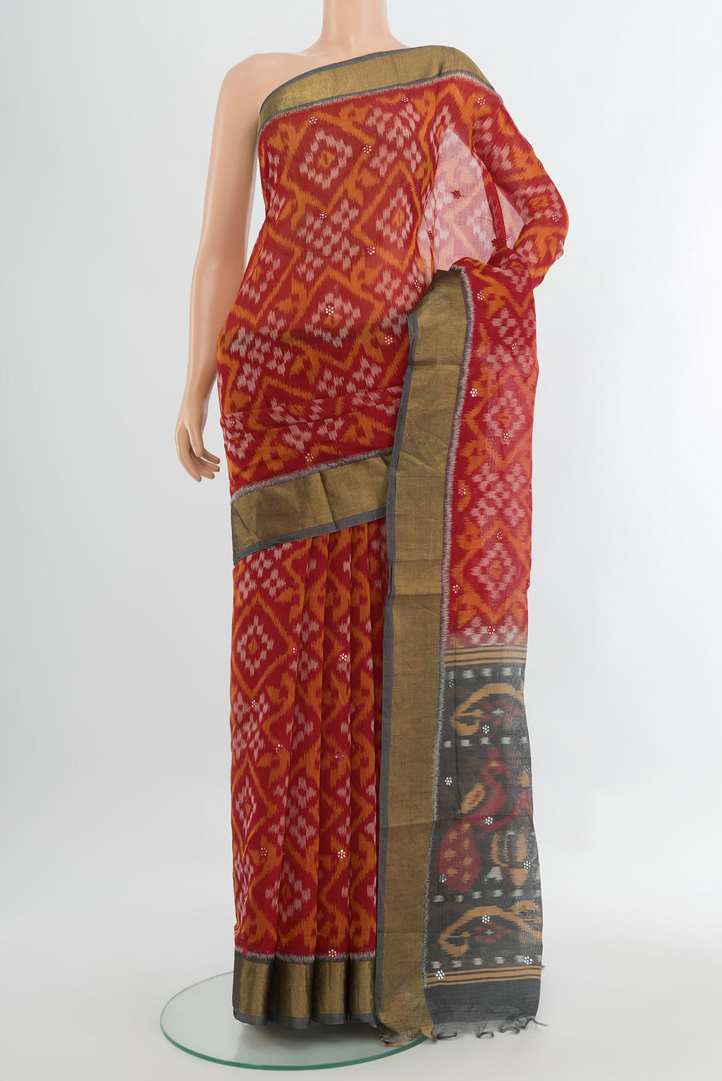 Multi Color Kora Cotton Saree with Ikat Print on the body and Silk Border.  displayed on a mannequin