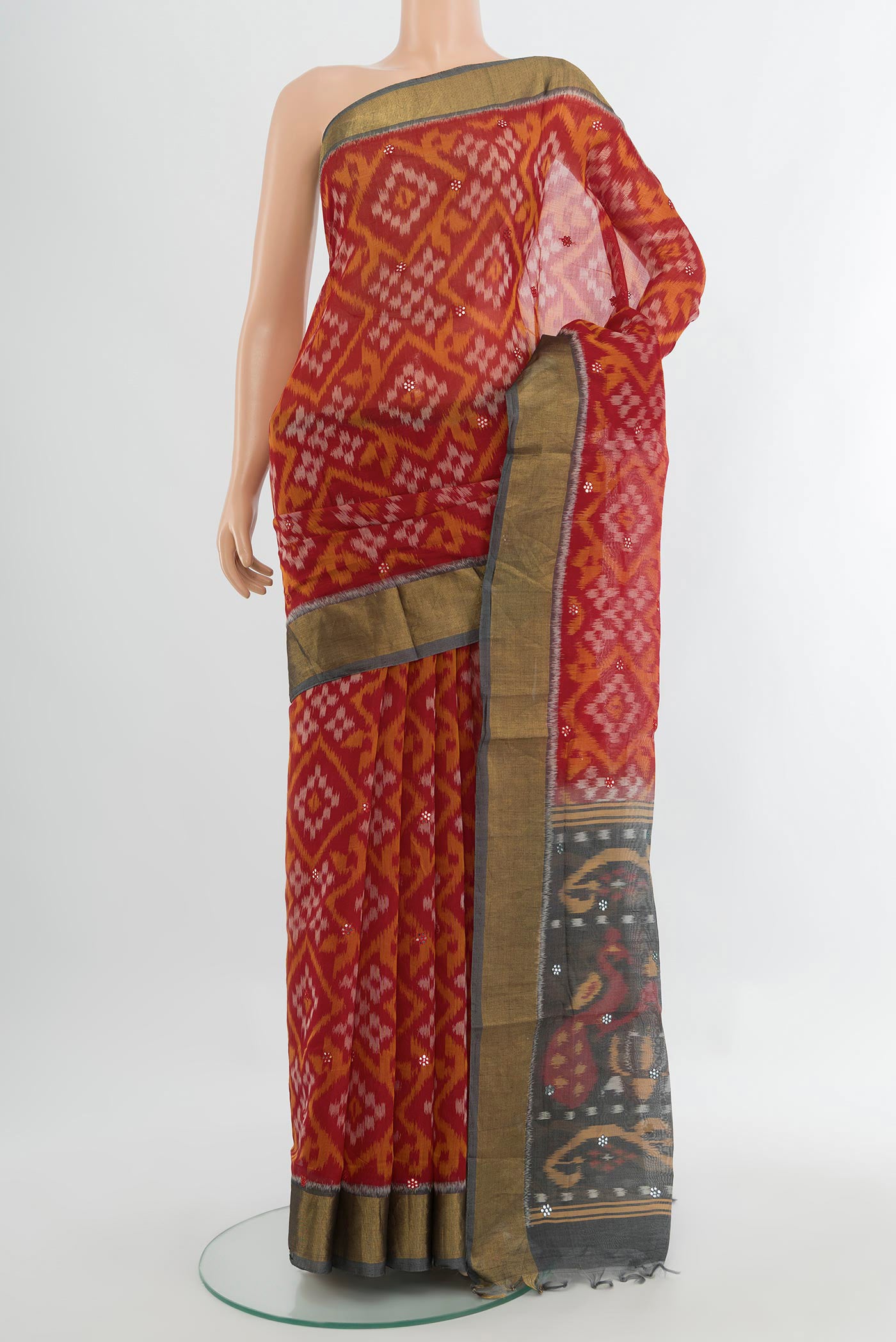 Multi Color Kora Cotton Saree with Ikat Print on the body and Silk Border.  displayed on a mannequin