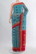 Blue Silk Cotton Saree with Ikat Print on the body and Zari Border.  displayed on a mannequin