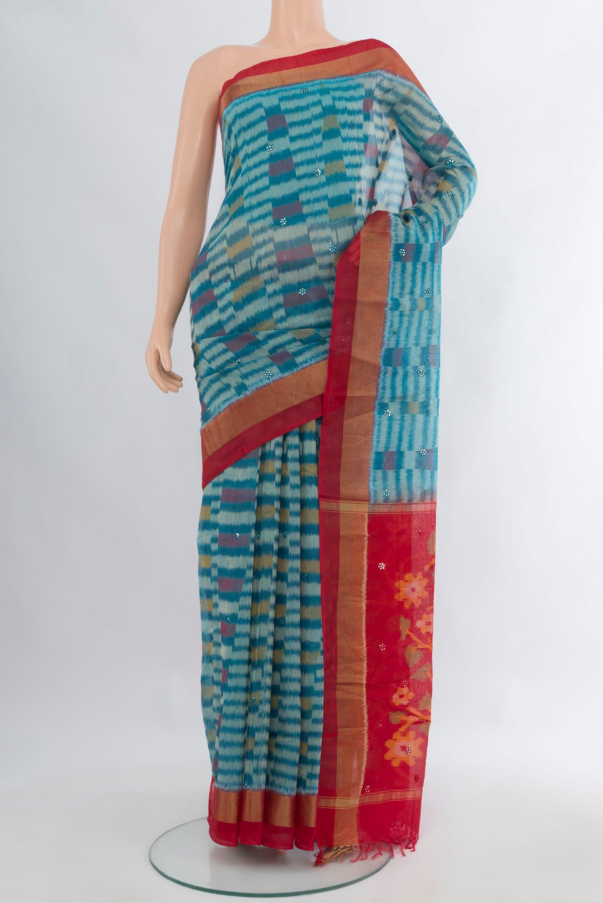 Blue Silk Cotton Saree with Ikat Print on the body and Zari Border.  displayed on a mannequin