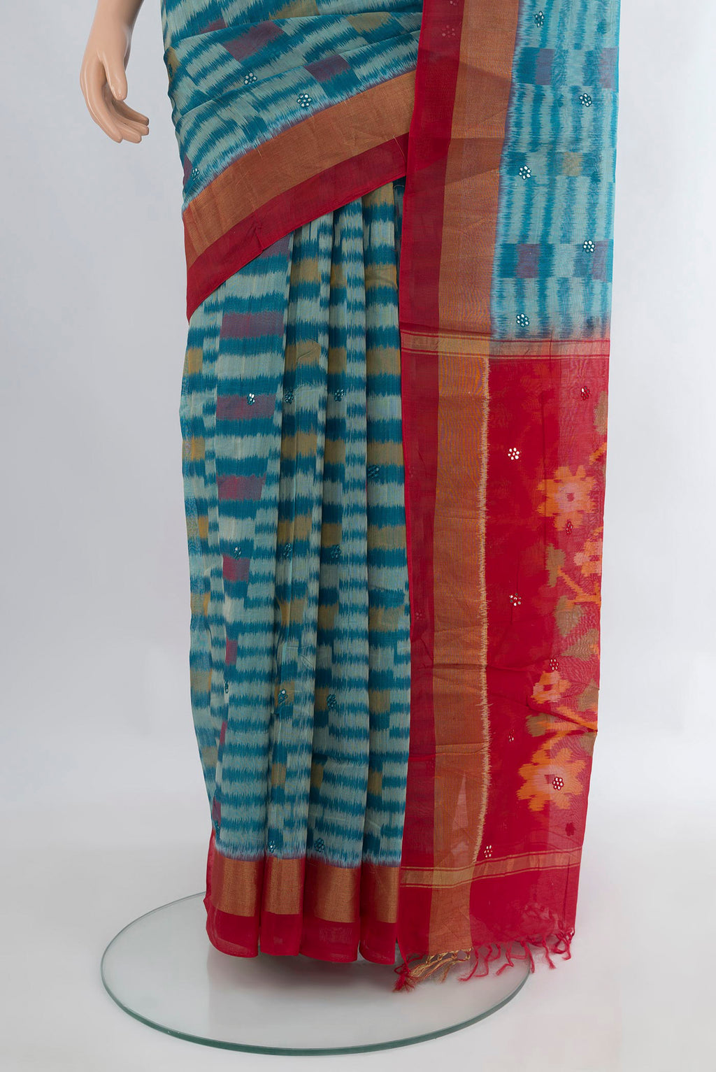 Pleats and pallu of Blue Silk Cotton Saree with Ikat Print on the body and Zari Border. 
