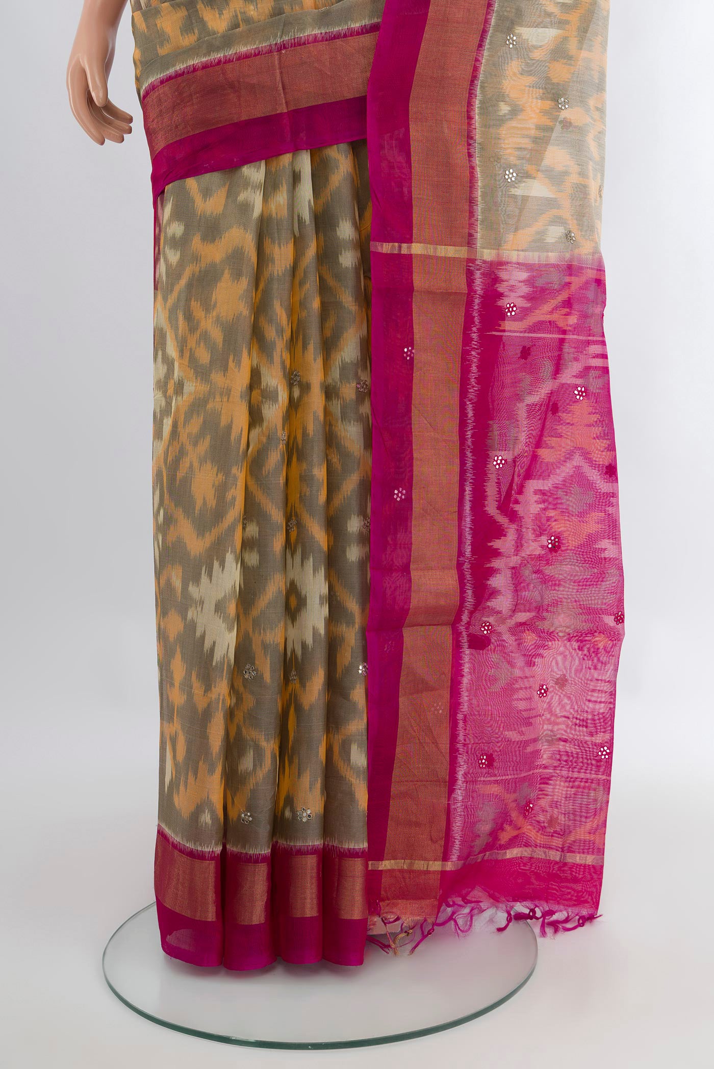 Pleats and pallu of Grey Silk Cotton Saree with Ikat Print on the body and Zari Border. 