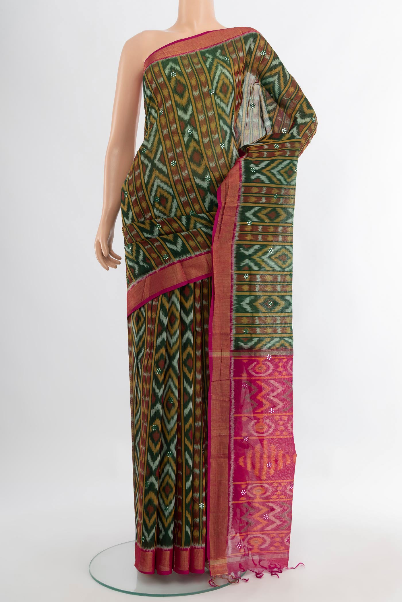 Multi Color Kora Cotton Saree with Ikat Print on the body and Silk Border.  displayed on a mannequin