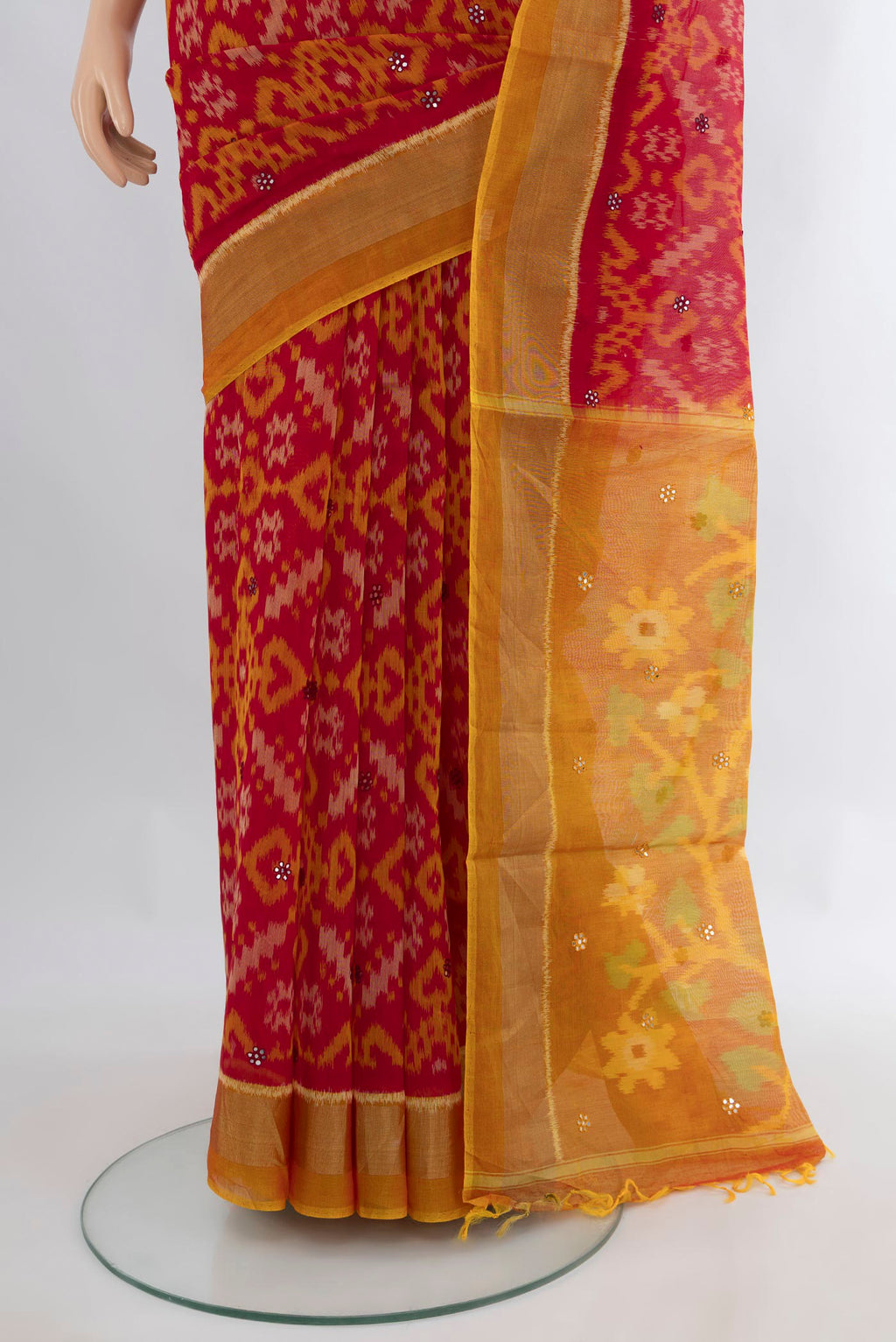 Pleats and pallu of Maroon Silk Cotton Saree with Ikat Print on the body and Zari Border. 