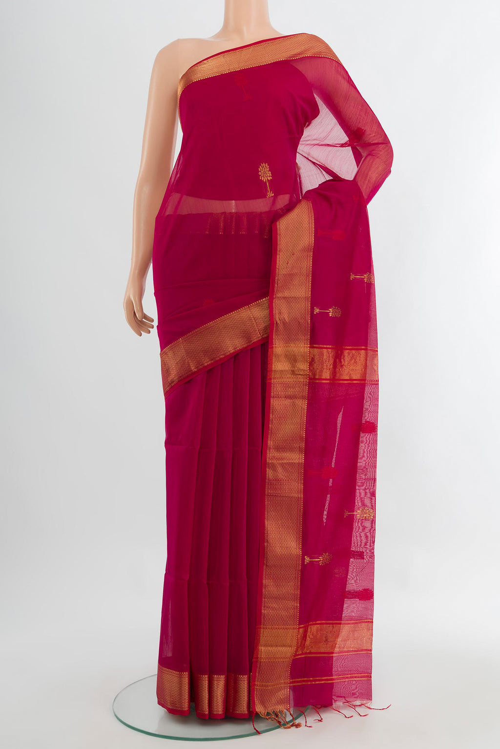 Dark Pink Maheshwari Silk Cotton Saree with Zari Butta on the body and Silk Border.  displayed on a mannequin