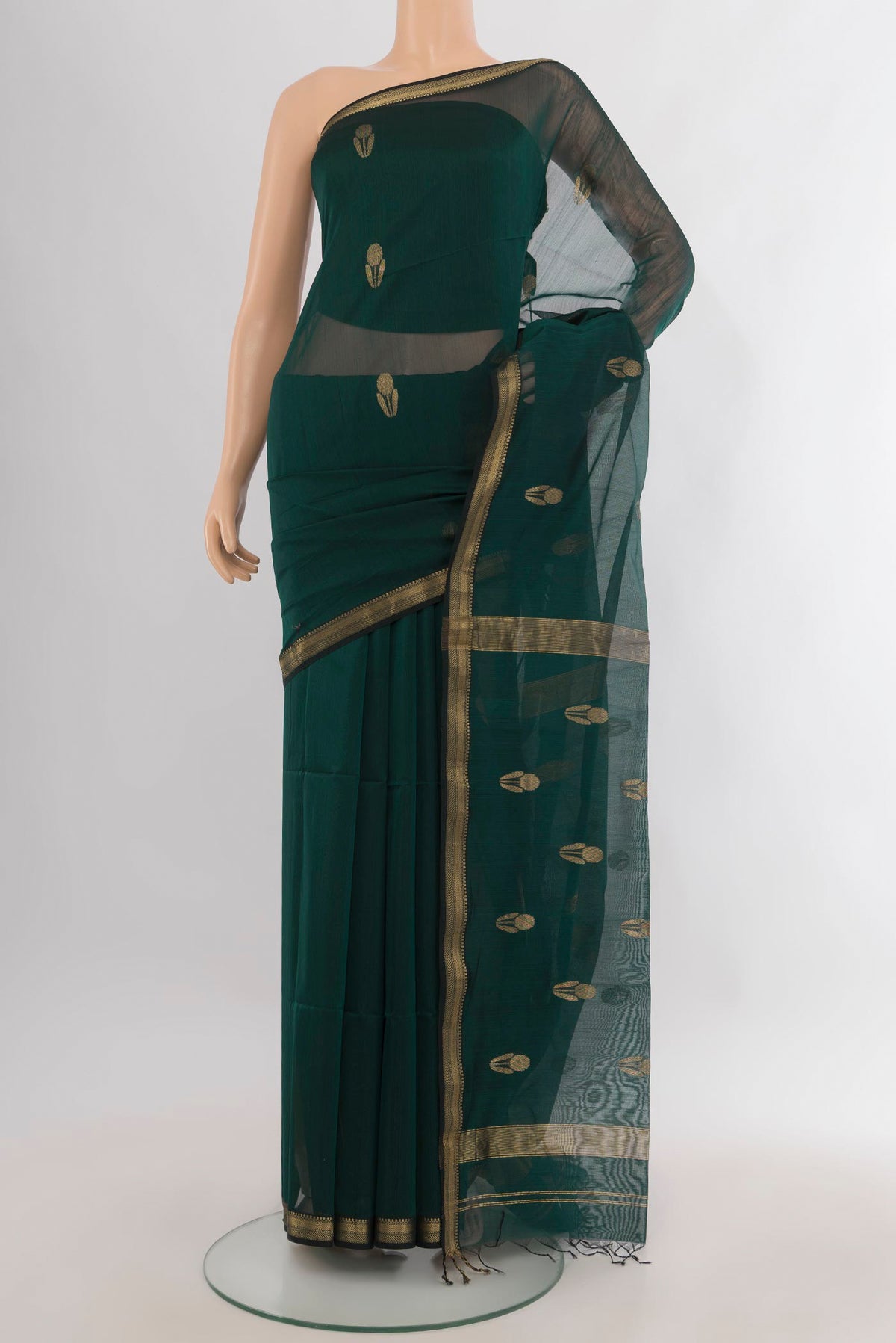 Bottle Green Maheshwari Cotton Saree with Zari Butta on the body and Zari Border.  displayed on a mannequin