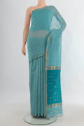 Multi Color Maheshwari Cotton Saree with Checked design on the body and Zari Border.  displayed on a mannequin