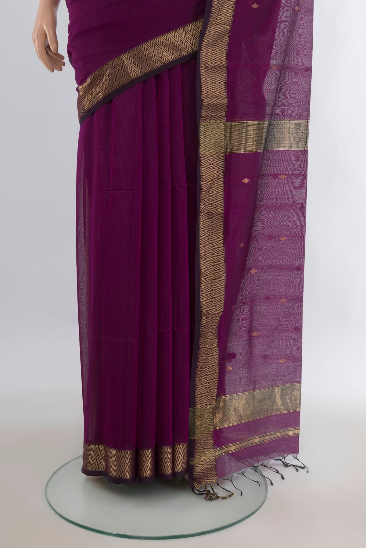 Pleats and pallu of Purple Maheshwari Cotton Saree with Zari Butta on the body and Zari Border. 