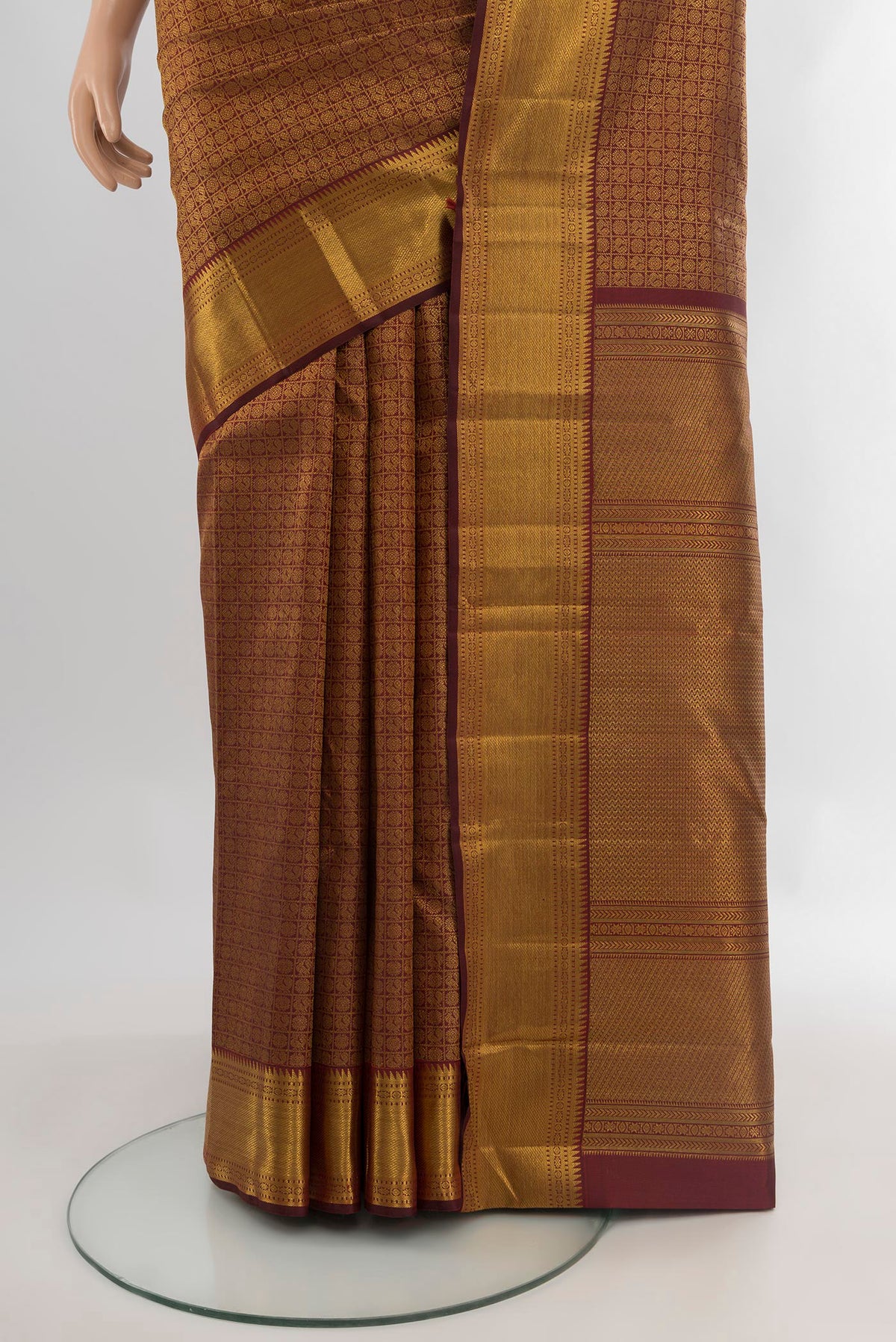 Pleats and pallu of Pure Silk Pure Zari Coffee Brown Kanjivaram Saree with Zari Brocade on the body and Zari Border. 