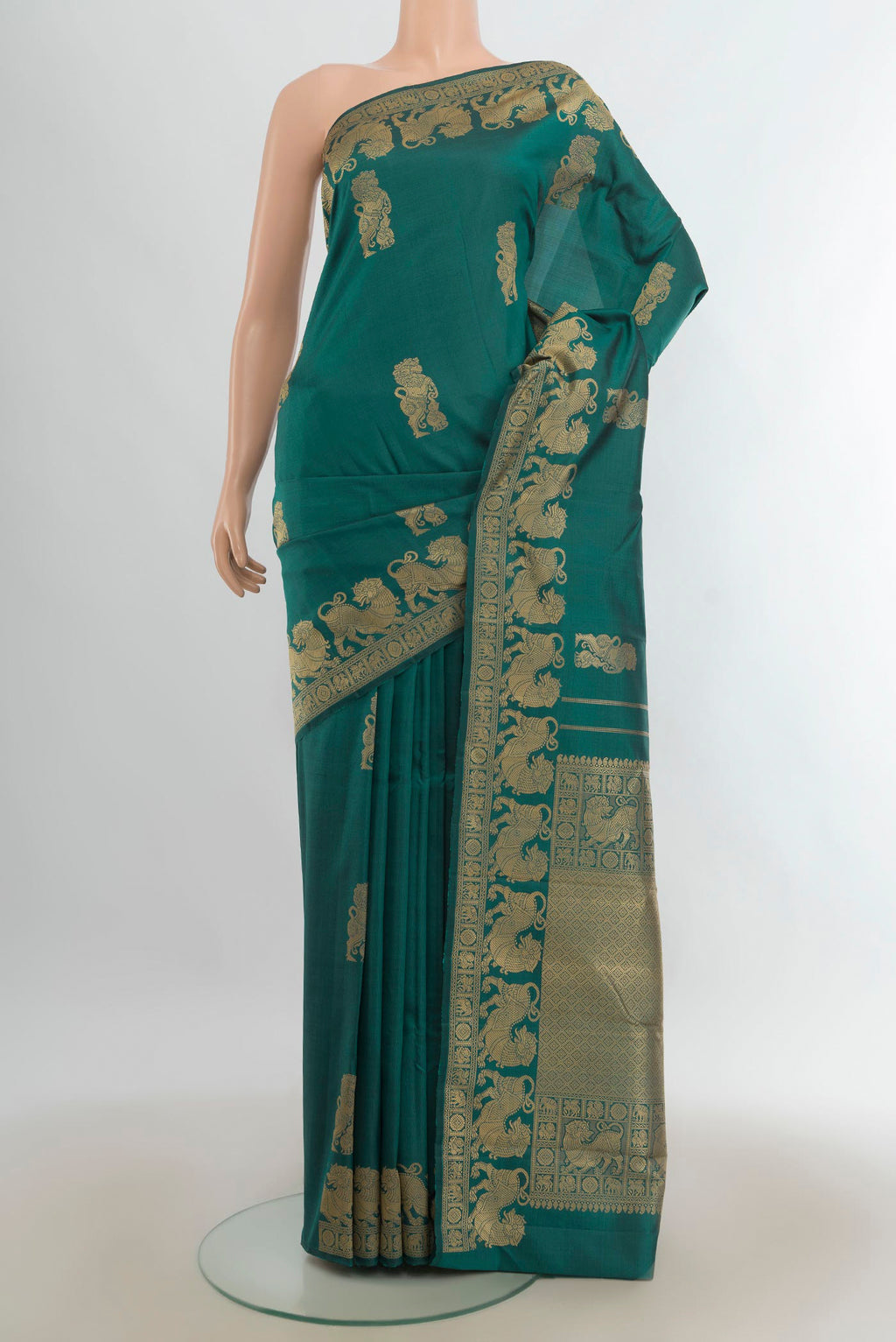 Pure Silk Blue Kanjivaram Saree with Plain Body and Silk Border.  displayed on a mannequin