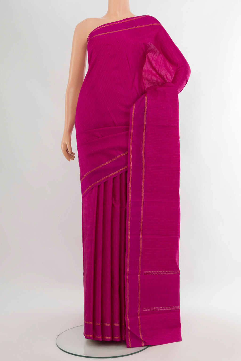 Magenta Kanjivaram Silk Saree with Checked design on the body and Plain Border.  displayed on a mannequin