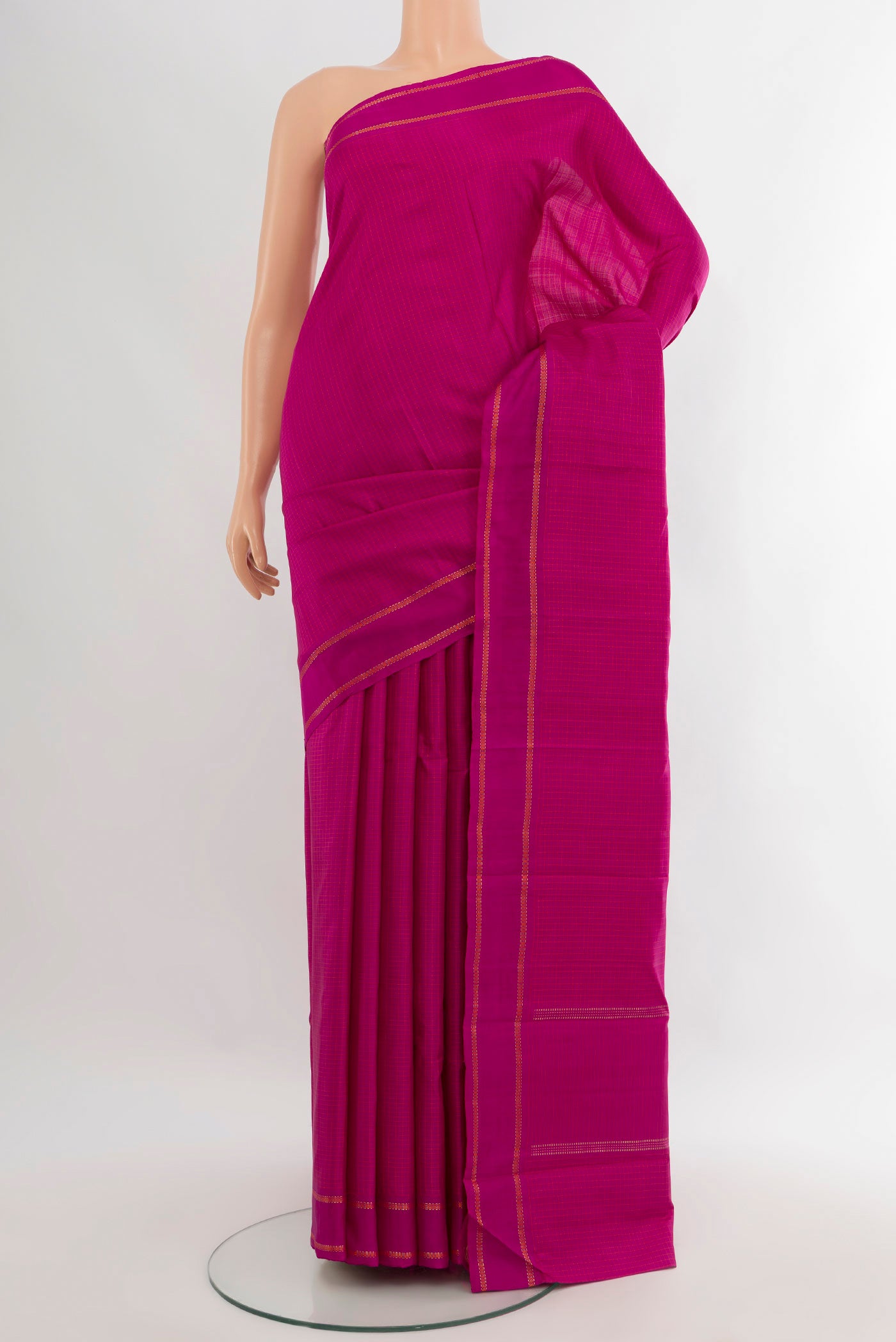 Magenta Kanjivaram Silk Saree with Checked design on the body and Plain Border.  displayed on a mannequin