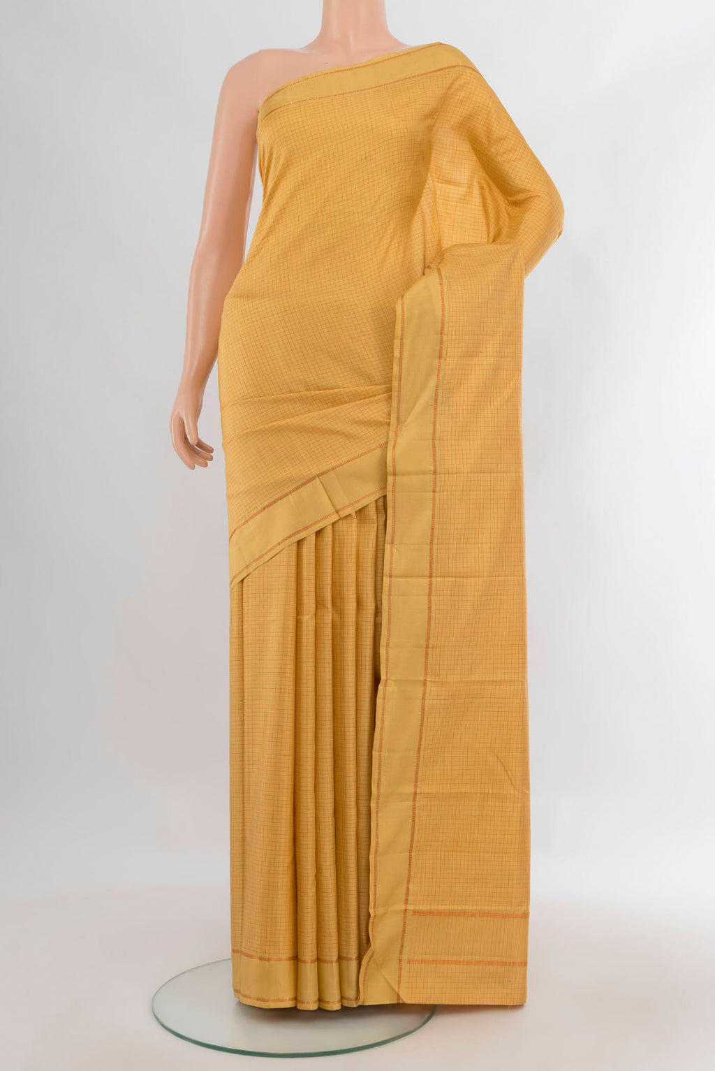 Pure Silk Yellow Kanjivaram Saree with Checked design on the body and Plain Border.  displayed on a mannequin