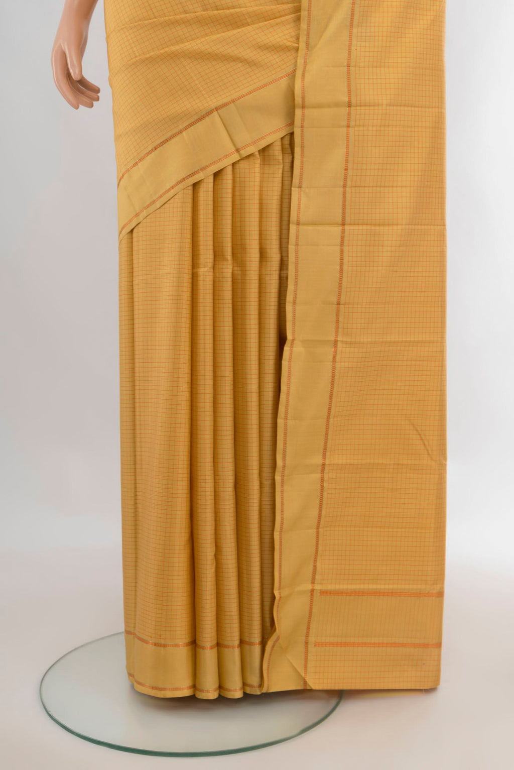 Pleats and pallu of Pure Silk Yellow Kanjivaram Saree with Checked design on the body and Plain Border. 