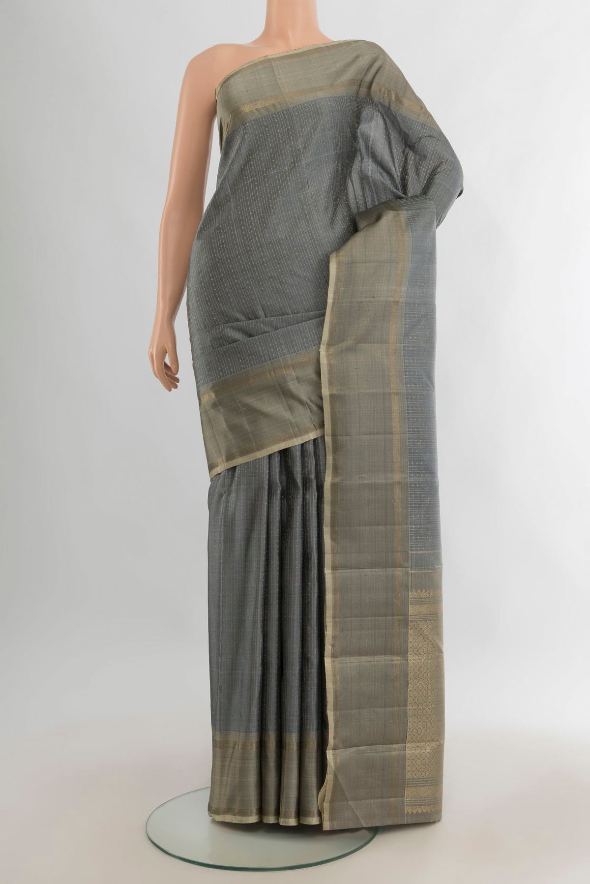 Pure Silk Davys Grey Kanjivaram Saree with Stripes on the body and Zari Border.  displayed on a mannequin