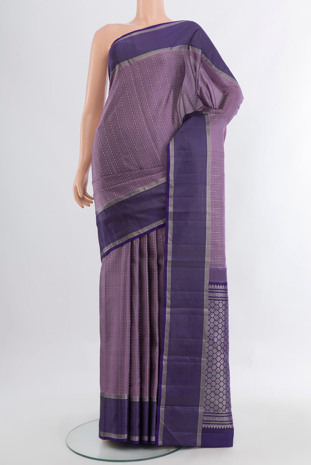 Pure Silk Pure Zari Lavender Kanjivaram Saree with Zari Butta on the body and Silk Border.  displayed on a mannequin
