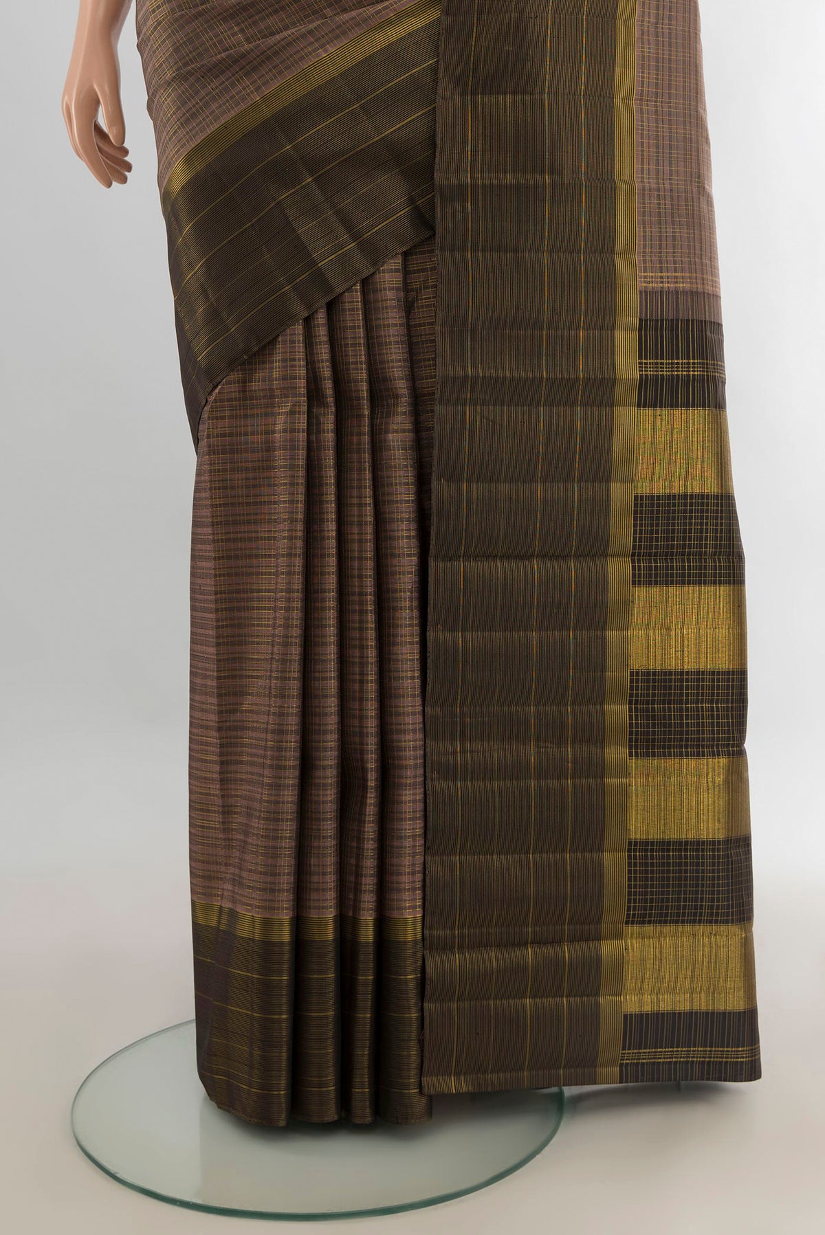 Pleats and pallu of Pure Silk Brown Kanjivaram Saree with Checked design on the body and Zari Border. 