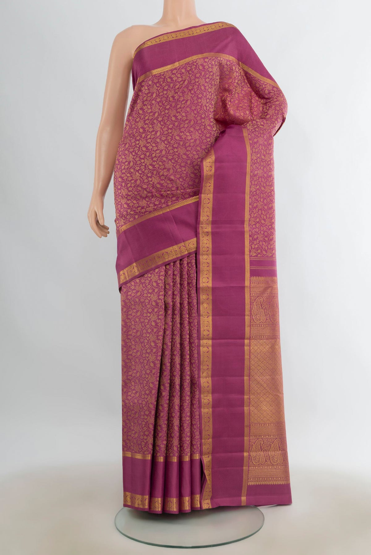 Pure Silk Pink Kanchipuram Saree with Jacquard design on the body and Zari Border.  displayed on a mannequin
