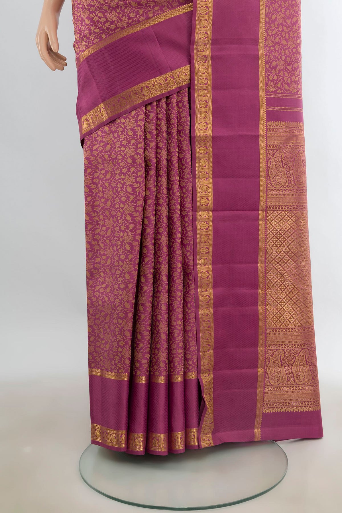 Pleats and pallu of Pure Silk Pink Kanchipuram Saree with Jacquard design on the body and Zari Border. 