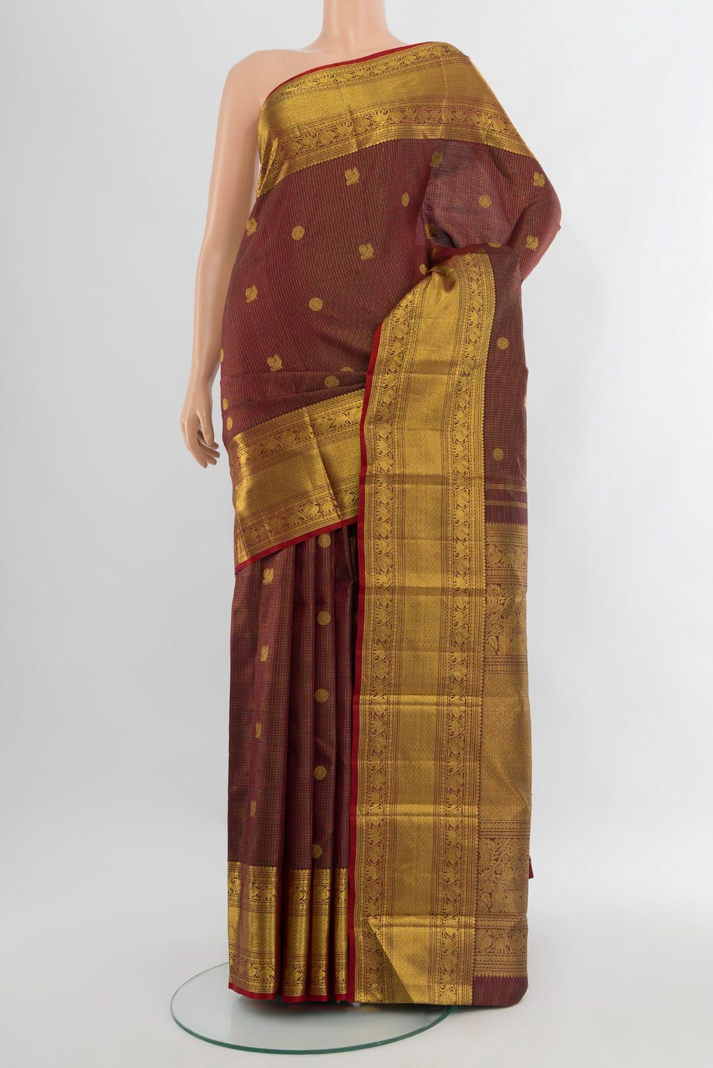 Coffee Brown Kanchipuram Silk Saree with Zari Butta on the body and Zari Border.  displayed on a mannequin