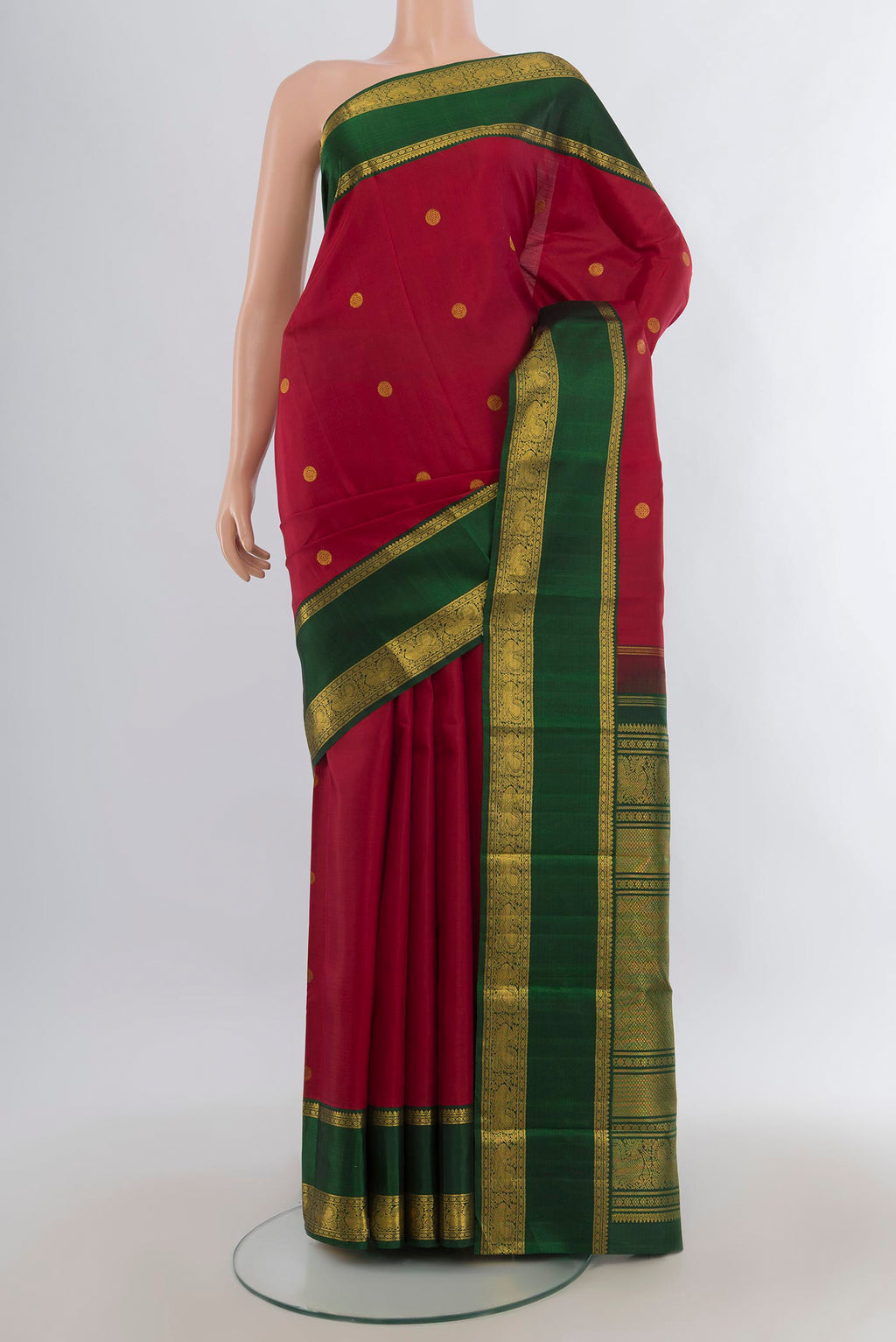 Pure Silk Maroon Kanchipuram Saree with Zari Butta on the body and Zari Border.  displayed on a mannequin