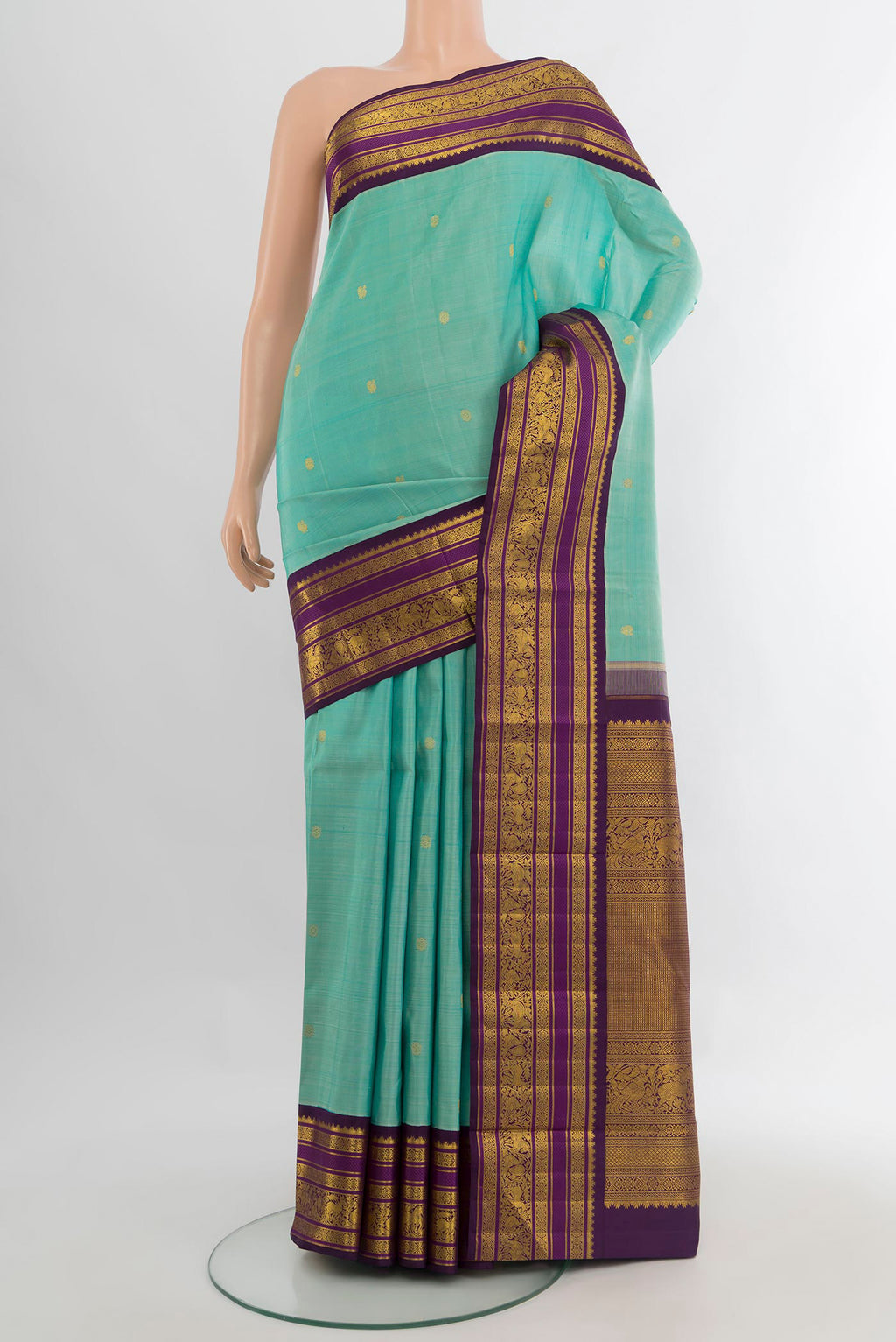 Pure Silk Sky Blue Kanchipuram Saree with Zari Butta on the body and Zari Border.  displayed on a mannequin