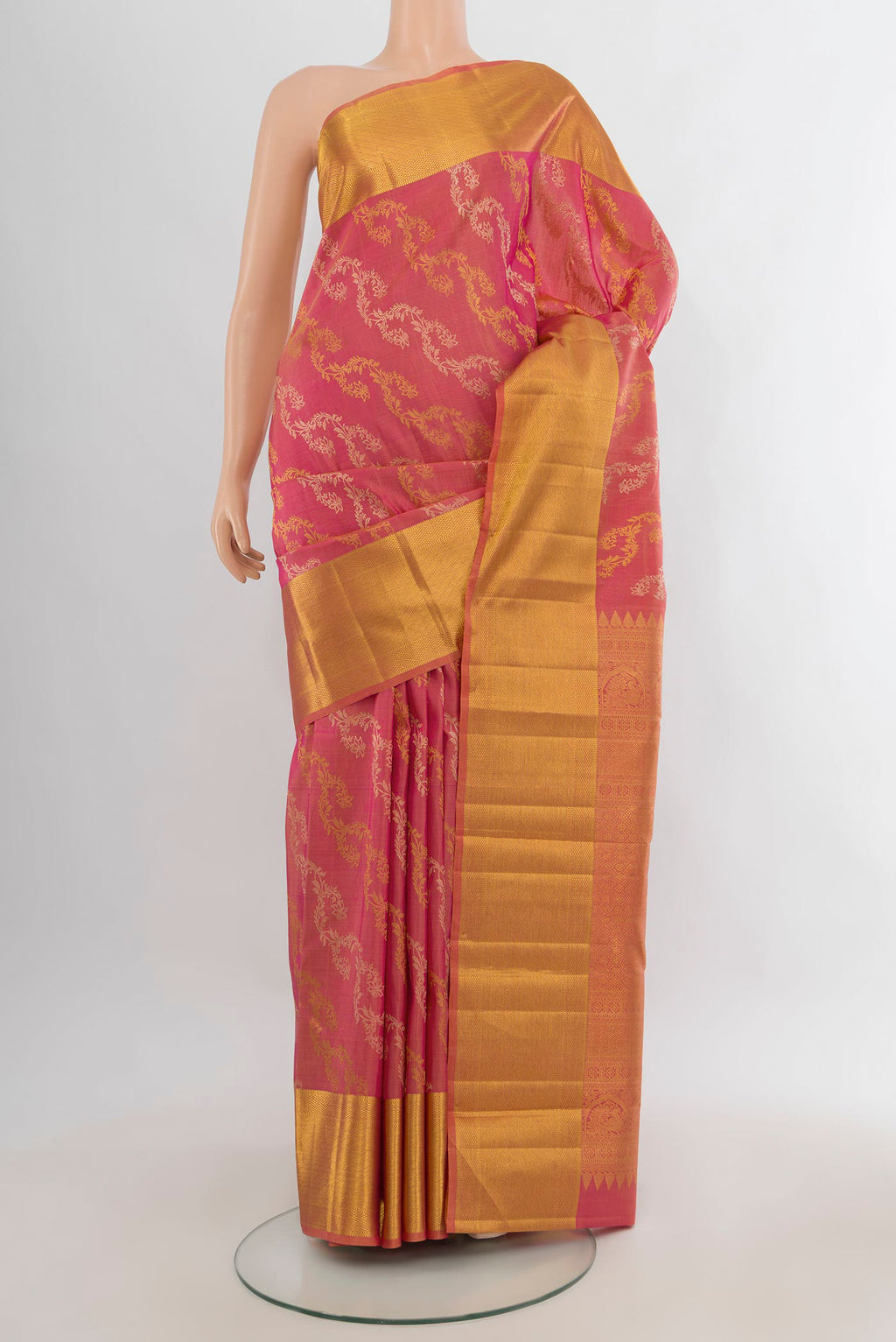 Pure Silk Coral Kanchipuram Saree with Zari Brocade on the body and Zari Border.  displayed on a mannequin