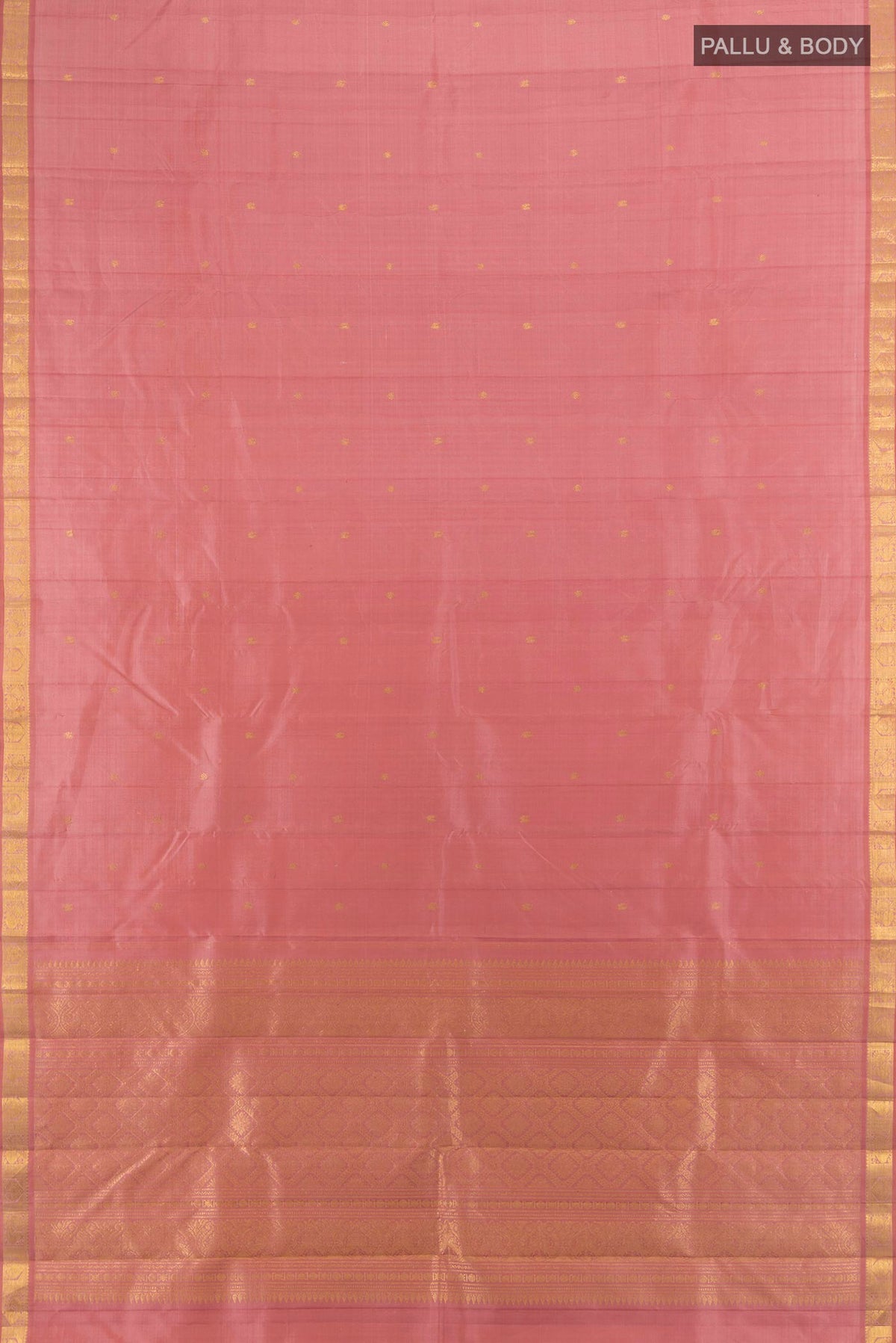 Flat view of Pure Silk Rose Gold Kanjivaram Saree with Zari Butta on the body and Silk Border. 