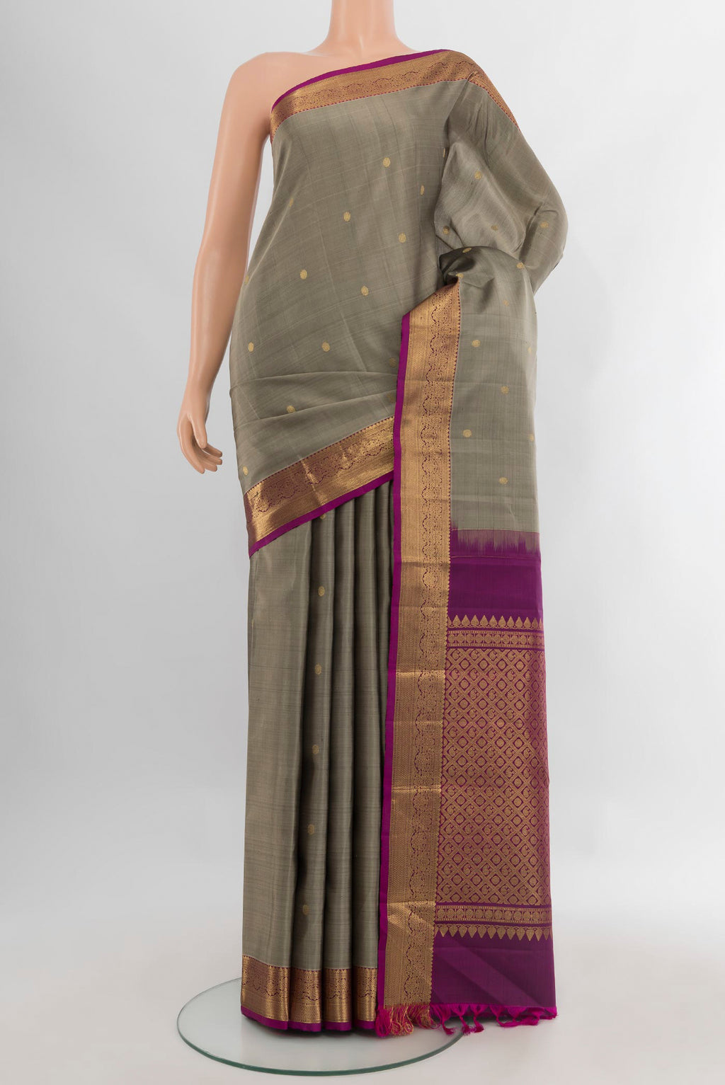Grey Kanjivaram Silk Saree with Zari Butta on the body and Zari Border.  displayed on a mannequin