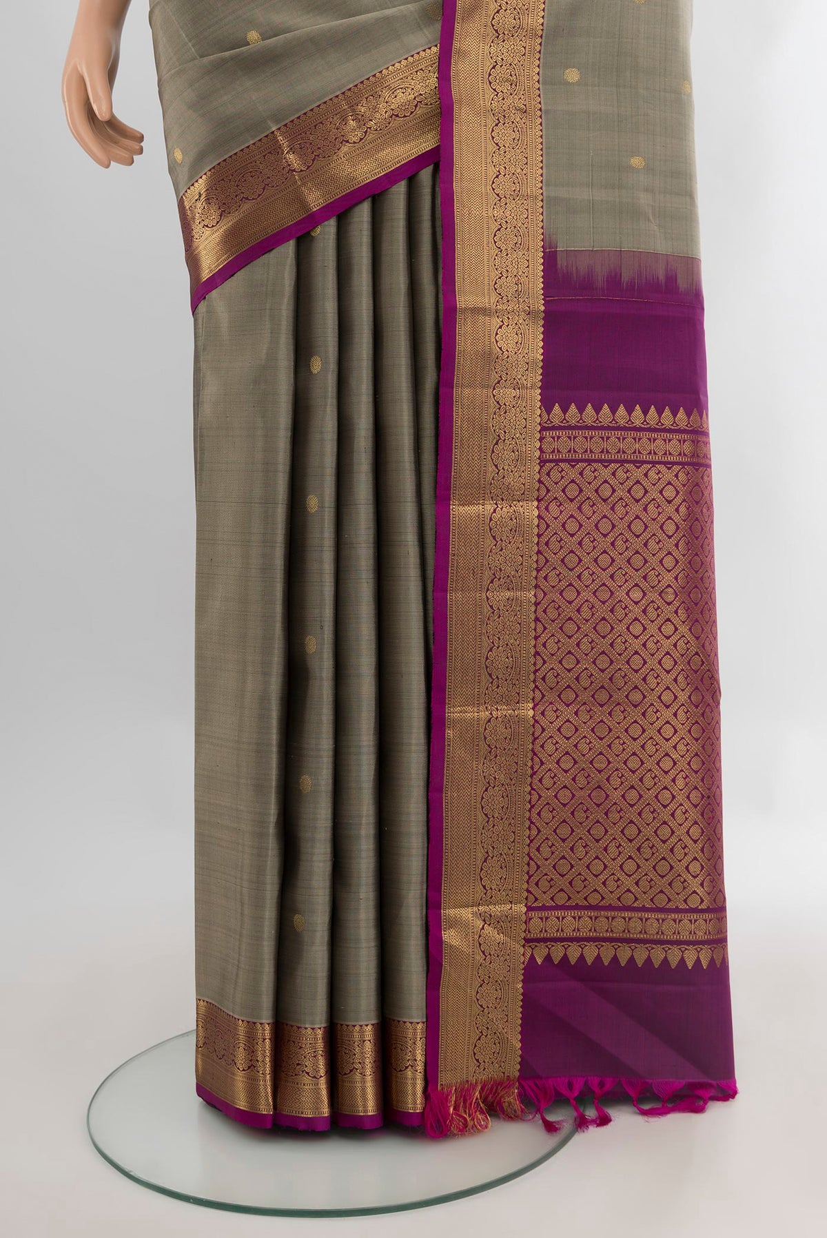 Pleats and pallu of Grey Kanjivaram Silk Saree with Zari Butta on the body and Zari Border. 