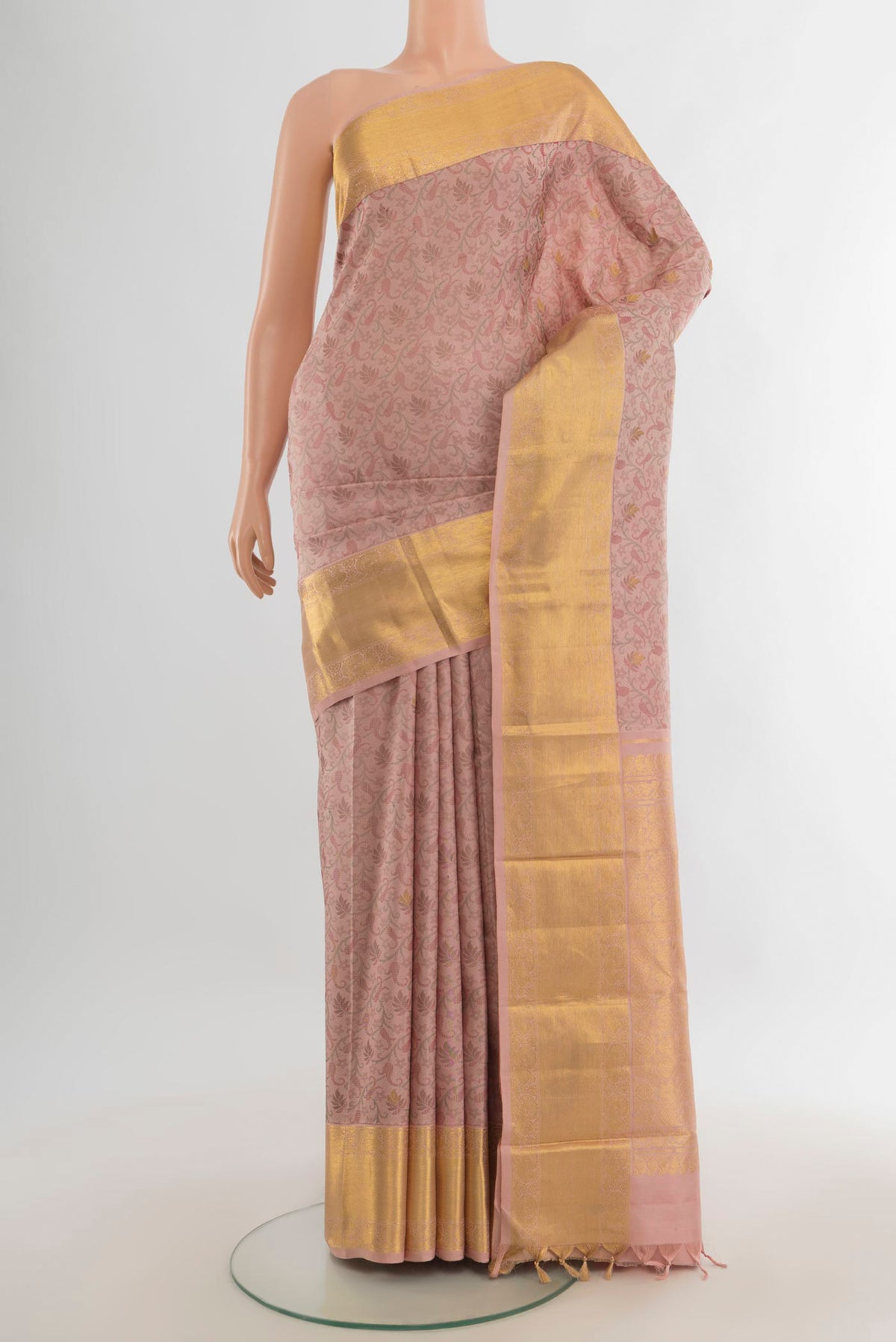 Pure Silk Peach Kanchipuram Saree with Jacquard design on the body and Zari Border.  displayed on a mannequin