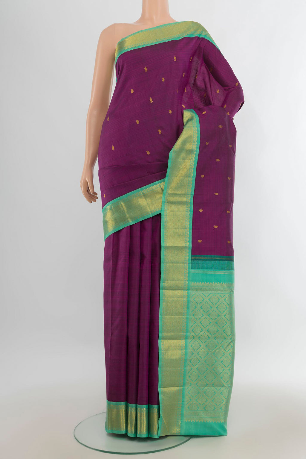 Pure Silk Pure Zari Violet Kanjivaram Saree with Zari Butta on the body and Silk Border.  displayed on a mannequin