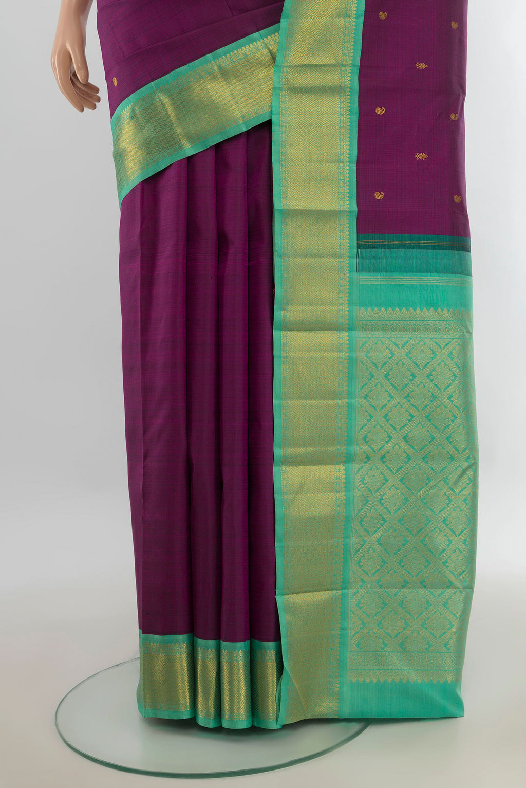 Pleats and pallu of Pure Silk Pure Zari Violet Kanjivaram Saree with Zari Butta on the body and Silk Border. 