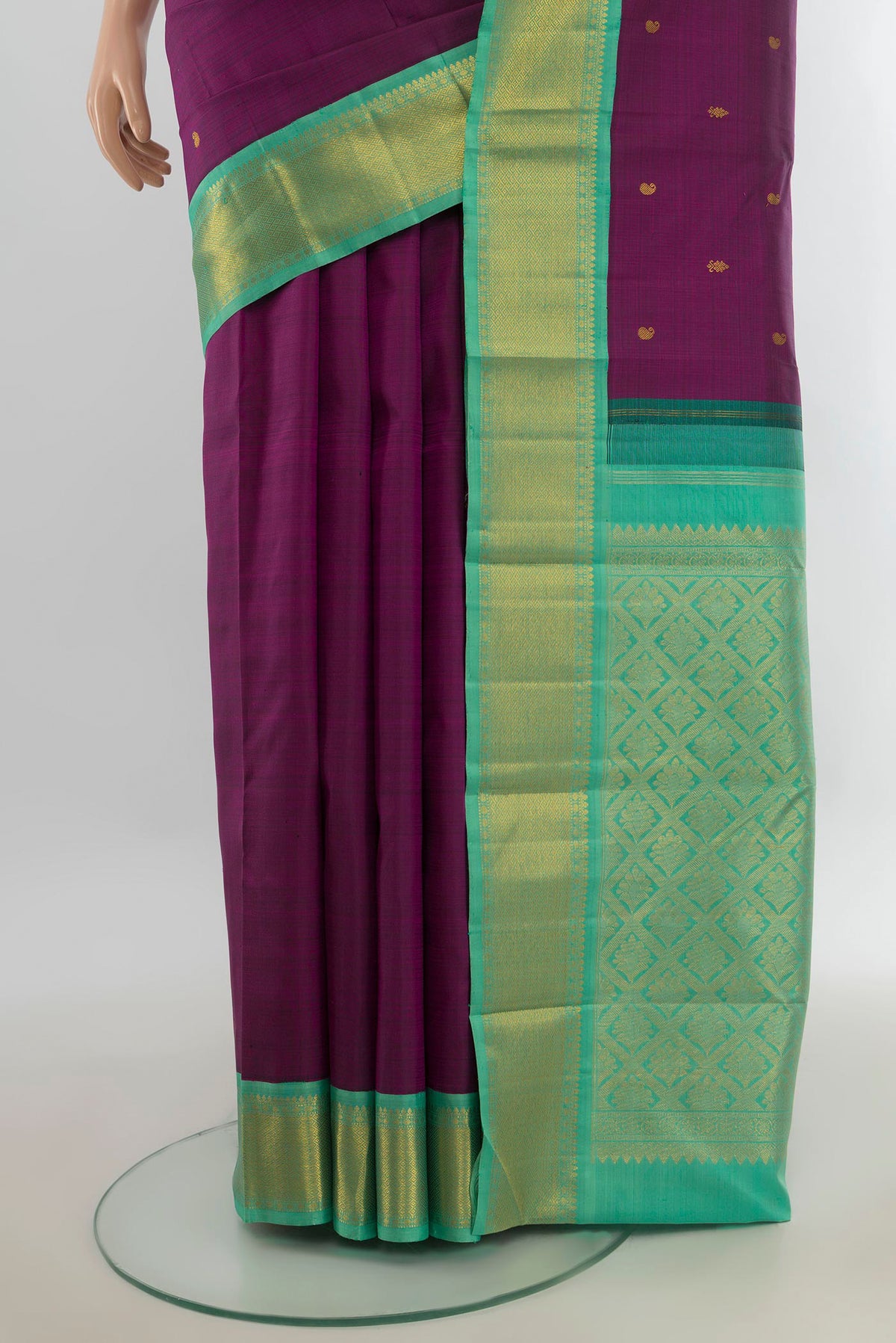 Pleats and pallu of Pure Silk Pure Zari Violet Kanjivaram Saree with Zari Butta on the body and Silk Border. 