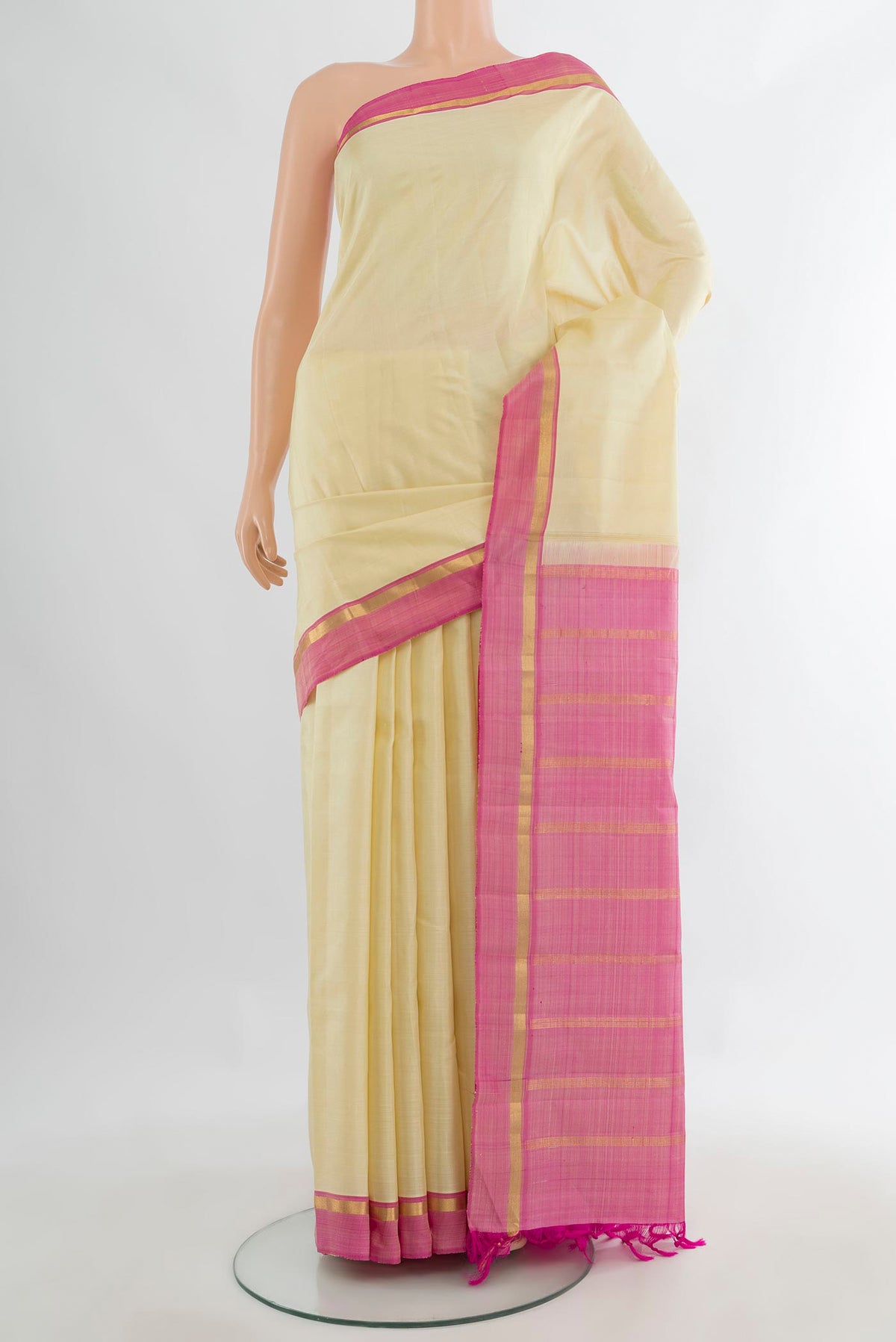 Pure Silk Cream Kanjivaram Saree with Plain Body and Plain Border.  displayed on a mannequin